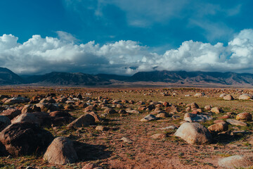 Beautiful mountains landscape with big stones in front