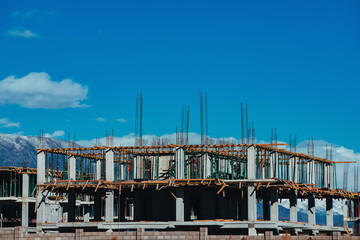 Building construction on mountains and sky background