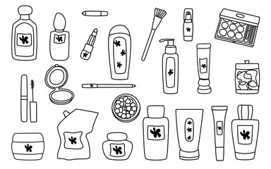 Collection of various beauty and skincare products arranged artistically on a flat surface. An assortment of beauty and skincare items is displayed in a creative layout.