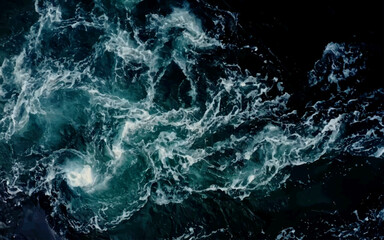 Top view. Foam on the ocean shore. Waves on the water. Contrasting image. Moody colors. Soft textured background. Mystic spring, Monotonous concrete background