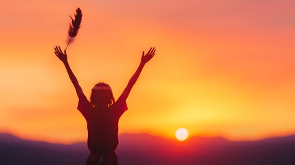 Fototapeta premium Silhouette of person raising arms at sunset, orange sky, inspirational celebration, freedom and victory concept, copy space for text, minimalism, spiritual ritual, outdoor evening scene