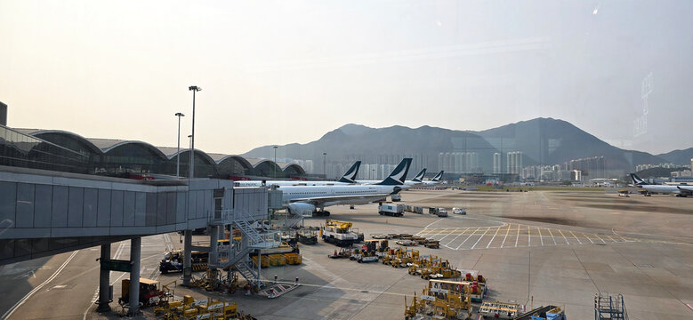 Panoramic View of Hong Kong International Airport Apron with Aircraft and Mountain Chek Lap Kok, Hong Kong, captured on 2nd April 2025