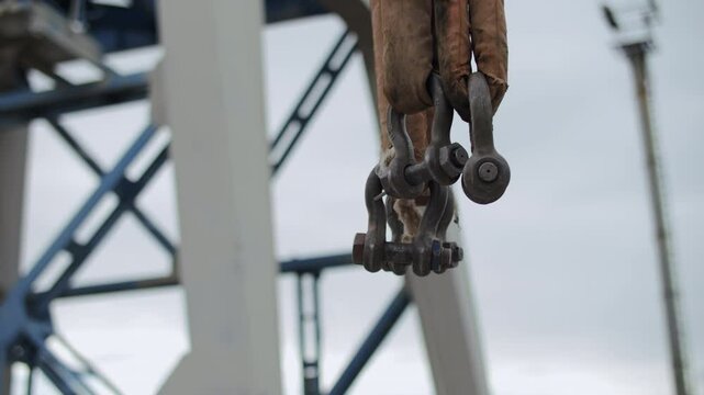 Lifting slings with shackles on port crane