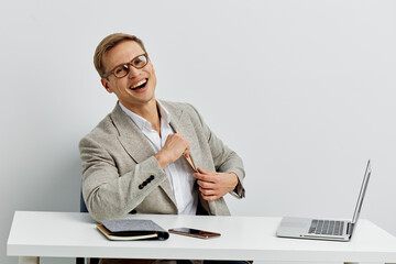 Confident middle-aged woman in business attire smiling cheerfully at camera while sitting at a...