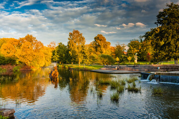 Reflection over the lake of Odense in autumn,  Denmark