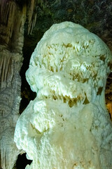 Exploring beautiful Postojna cave in Slovenia the most visited european cave.  Thousands of stalagmites and stalactites