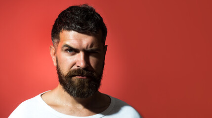 Man portrait. Serious bearded man in casual clothes. Handsome guy with modern hairstyle. Pensive...