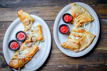 italian calzone stuffed with cheese and pepperoni.
