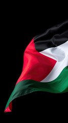 The Palestinian flag featuring black red white and green colors waves gracefully against a dark backdrop symbolizing national identity and unity
