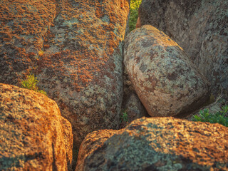 close up view to granite boulders in sunset light