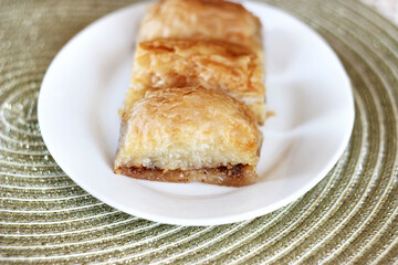 sweet baklava in a plate on the table