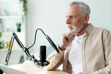Senior radio host recording podcast in home studio