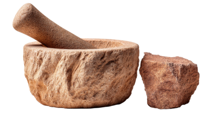 A detailed shot of a stone mortar and pestle, used for grinding spices.