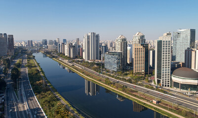 Urban cityscape with buildings along a Pinheiros river, and Marginal Pinheiros in Sao Paulo city.