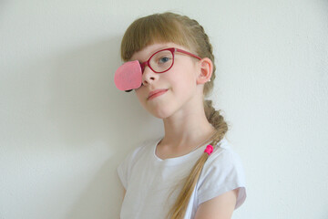 portrait of a girl in glasses. myopia since childhood. vision correction by occlusion. treatment of...