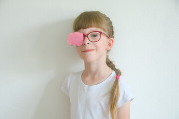 portrait of a girl in glasses. myopia since childhood. vision correction by occlusion. treatment of amblyopia and strabismus in childhood. treatment of Brown syndrome, lazy eye