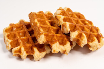 Belgian waffles isolated on white background, sugar waffles tasty dessert, appetizing and tasty
