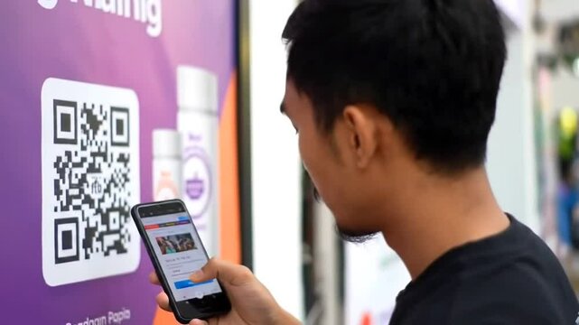 Man scanning QR code with smartphone