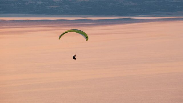 Solo Paraglider Flying at Paragliding Festival &ndash; Aerial Sports Moment