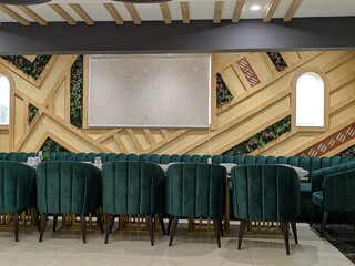 antique library interior, large arched windows, wooden shelves and beams, green leather armchairs, projection screen, ornate decor, detailed texture, moody lighting, cinematic composition
