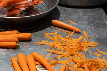 Preparing Fresh Carrots is on the iron table