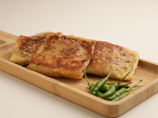 Folded pastry filled with meat filling and fried until golden brown