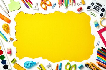 Frame border made of colorful school and art supplies on white background with yellow center. Back...