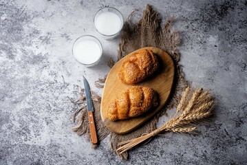 Sesame seeds braided bun on a grey background