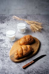 Sesame seeds braided bun on a grey background