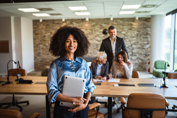 Portrait of a beautiful african american businesswoman hold laptop
