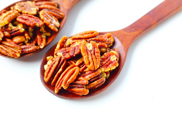 Delicious salted pecan nuts scattered.