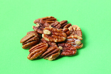 Delicious salted pecan nuts scattered.