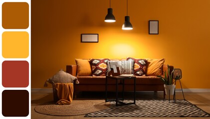 Interior of living room with sofa, table and glowing lamps at night. Different color patterns