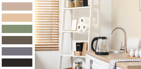 Electric kettle with water near sink on table in kitchen
