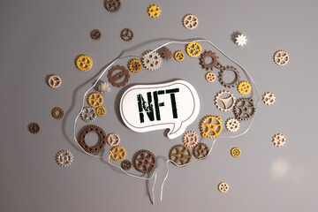 NFT text on torn paper.