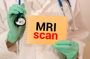 MRI - text on cubes standing on a stone on a natural background.