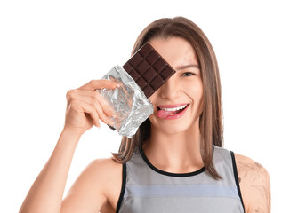 Young woman with chocolate bar on white background