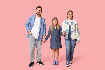 Obraz premium Happy family in stylish denim clothes on pink background