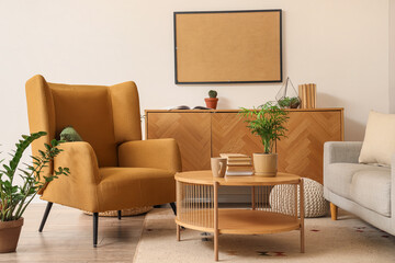 Light living room with brown armchair, cozy sofa, coffee table and chest of drawers