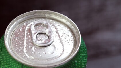 Cold canned beer ready to drink in the fridge
