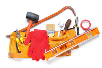 Belt with gloves and construction tools on white background