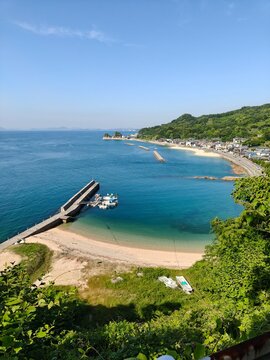 Capturing the serene beauty of the Seto Inland Sea, this collection showcases picturesque beaches, clear turquoise waters, and lush green hills surrounding Fuwari Peninsula in Ehime Prefecture, Japan.