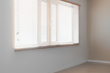 Window with wooden blinds in room