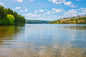 The Spokane River as it runs past the Nine Mile Recreation Area, with park, trails and boat launch, in Nine Mile Washington State, Spokane County at Spring in the Inland Northwest, USA.