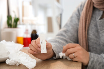 Sick woman with cito test at home, closeup
