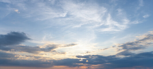 Obraz premium Beautiful morning or evening blue and orange sky with cloudy while sunsets or sunrises taken at the sea used as natural background texture