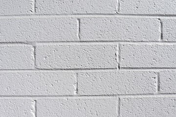 White brick wall texture. White background with bricks and for presentation.  Brick backdrop.