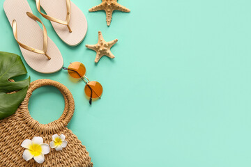 Summer composition with starfishes and beach accessories on turquoise background, closeup