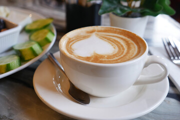 Beautiful latte art in a cozy cafe setting