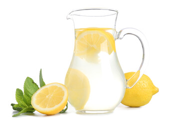 Jug with tasty lemonade, fresh lemons and mint on white background
